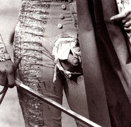 Matador with his cock hanging out of his torn troussers