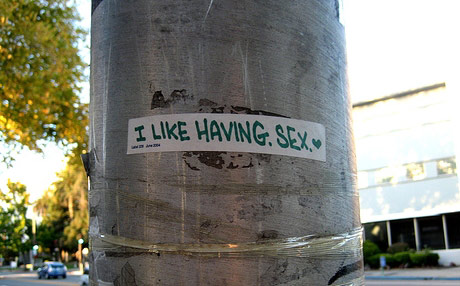 I like having sex written on a sticker in a city